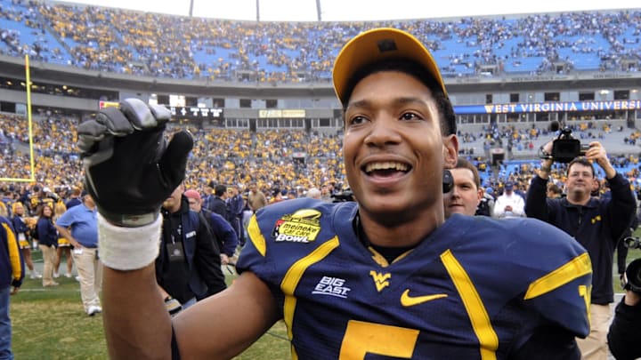Dec. 27, 2008; Charlotte, NC, USA; West Virginia Mountaneers  quarterback Pat White (5) reacts after the Mountaineers 31-30 victory against the North Carolina Tar Heels at Bank of America Stadium. Mandatory Credit: Bob Donnan-Imagn Images