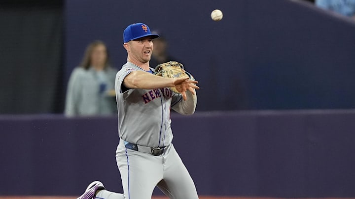 Sep 9, 2024; Toronto, Ontario, CAN; New York Mets first baseman Pete Alonso (20) throws out Toronto Blue Jays left fielder Nathan Lukes (not pictured) at first base during the second inning at Rogers Centre. Mandatory Credit: John E. Sokolowski-Imagn Images Sep 9, 2024; Toronto, Ontario, CAN; New York Mets first baseman Pete Alonso (20) throws out Toronto Blue Jays left fielder Nathan Lukes (not pictured) at first base during the second inning at Rogers Centre. Mandatory Credit: John E. Sokolowski-Imagn Images