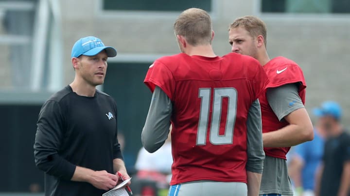 Detroit Lions offensive coordinator Ben Johnson talks with Detroit Lions quarterbacks Nate Sudfeld (10) and Jared Goff (16) after training camp at team headquarters in Allen Park on Friday, July 28, 2023.