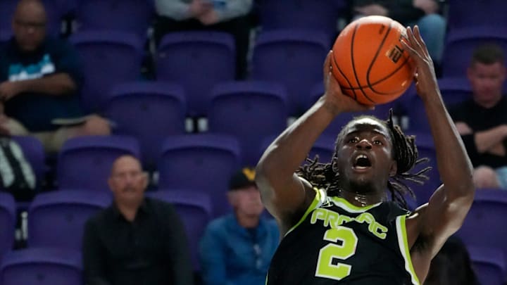 Prolific Prep player Caleb Holt attempts a jump shot over defender Oneal Delancy. Montverde Academy defeated Prolific Prep to win the 2025 GEICO City of Palms Classic Signature Series basketball championship at Suncoast Credit Union Arena in Fort Myers, Sunday Dec. 21, 2025. Montverde won with a final score of 78-73.