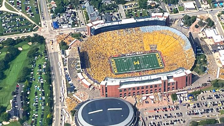 The Big House, home to the University of Michigan football team, had a maize out during the first home game of the 2023 season vs. East Carolina on Sept. 2, 2023. Photo was taken from a helicopter as the band played on the field shortly before kickoff.