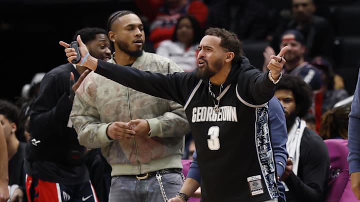 Jan 19, 2026; Washington, District of Columbia, USA; In cured Washington Wizards guard Trae Young gestures from he bench against the LA Clippers in the first half at Capital One Arena. Mandatory Credit: Geoff Burke-Imagn Images