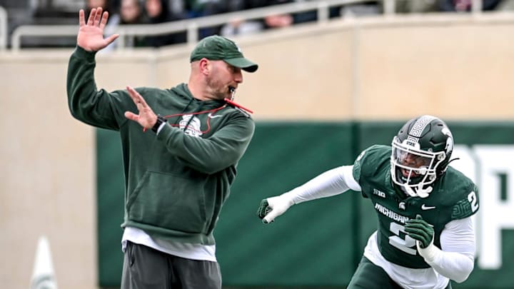 Michigan State's Khris Bogle, right, runs a drill with rush ends coach Chad Wilt during the Spring Showcase on Saturday, April 20, 2024, at Spartan Stadium in East Lansing.