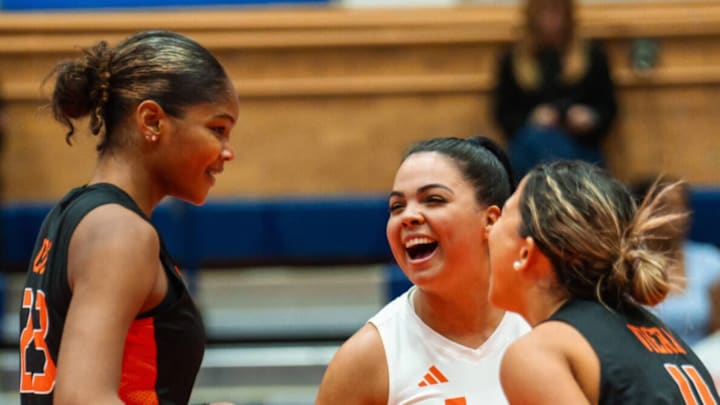 Miami Hurricanes Volleyball celebrating a victory against Syracuse. 