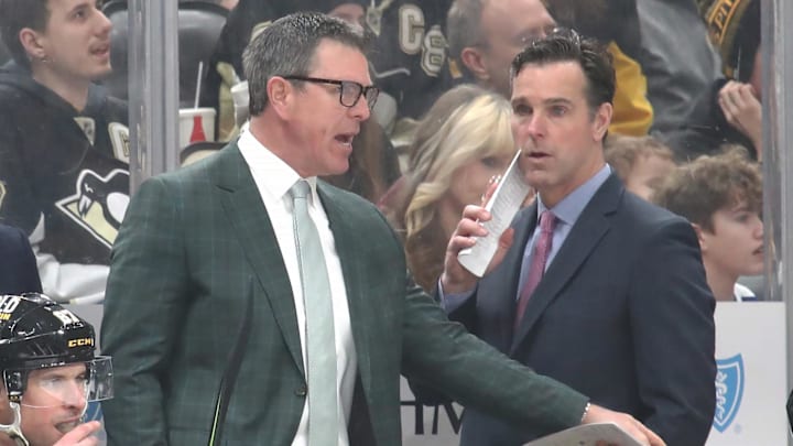 Pittsburgh Penguins head coach Mike Sullivan (left) gestures on the bench as assistant coach David Quinn (right) looks on. Pittsburgh Penguins head coach Mike Sullivan (left) gestures on the bench as assistant coach David Quinn (right) looks on.