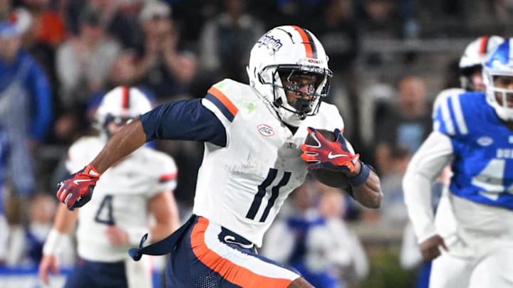Virginia Cavaliers wide receiver Trell Harris (11) runs the ball during the third quarter against the Duke Blue Devils at Wallace Wade Stadium. 