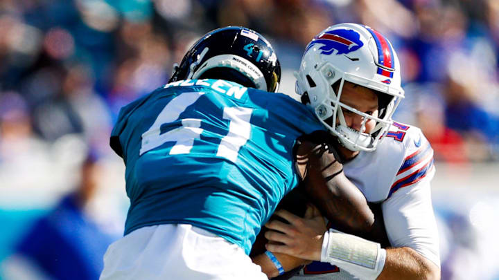 Nov 7, 2021; Jacksonville, Florida, USA;  Jacksonville Jaguars outside linebacker Josh Allen (41) sacks Buffalo Bills quarterback Josh Allen (17) in the first half at TIAA Bank Field. Mandatory Credit: Nathan Ray Seebeck-Imagn Images