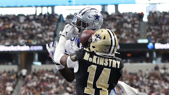 Sep 15, 2024; Arlington, Texas, USA; Dallas Cowboys wide receiver CeeDee Lamb (88) cannot catch a pass while defended by New Orleans Saints cornerback Kool-Aid McKinstry (14) at AT&T Stadium. Mandatory Credit: Tim Heitman-Imagn Images