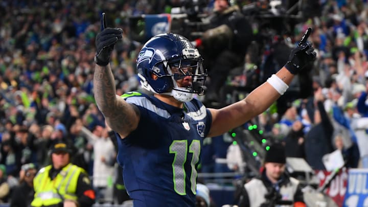 Jan 25, 2026; Seattle, WA, USA; Seattle Seahawks wide receiver Jaxon Smith-Njigba (11) celebrates after scoring a touchdown against the Los Angeles Rams during the first half in the 2026 NFC Championship Game at Lumen Field.