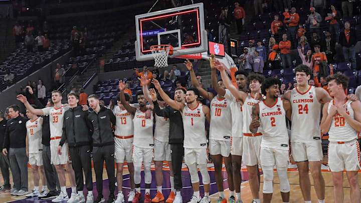 Dec 22, 2023; Clemson, South Carolina, USA; Clemson basketball team joins in the alma mater after the game with Queens University the game against Queens University at Littlejohn Coliseum. Mandatory Credit: Ken Ruinard-Imagn Images