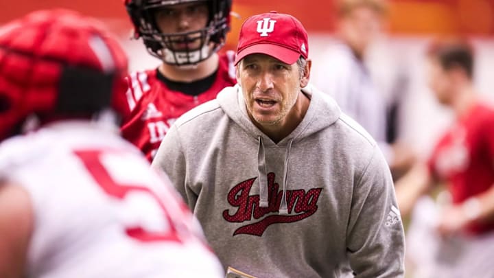 Indiana offensive line coach Bob Bostad goes through a drill during an offseason practice.