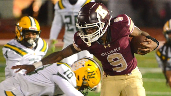 Killingly senior Everton Brown looks to break free from New London's Tyree Barnes during Killingly's 41-20 win Friday night at Morgan Field.