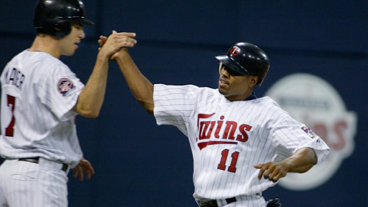 Minnesota Twins right fielder #11 Jacque Jones high-fives catcher #7 Joe Mauer after they each scored. Mandatory Credit: Photo By Bruce Kluckhohn-Imagn Images Copyright (c) 2005 Bruce Kluckhohn Minnesota Twins right fielder #11 Jacque Jones high-fives catcher #7 Joe Mauer after they each scored. Mandatory Credit: Photo By Bruce Kluckhohn-Imagn Images Copyright (c) 2005 Bruce Kluckhohn