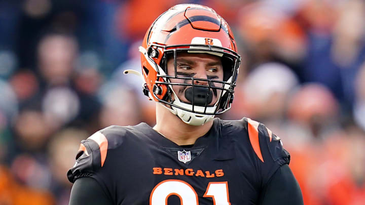 Cincinnati Bengals defensive end Trey Hendrickson (91), left, and Cincinnati Bengals defensive end Sam Hubbard (94) celebrate a sack in the second quarter during a Week 16 NFL game against the Baltimore Ravens, Sunday, Dec. 26, 2021, at Paul Brown Stadium in Cincinnati.