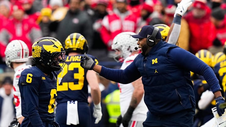 Michigan Wolverines head coach Sherrone Moore celebrates with defensive back Brandyn Hillman (6) in the first half of the NCAA football game at Michigan Stadium on Saturday, Nov. 29, 2025 in Ann Arbor, Michigan.