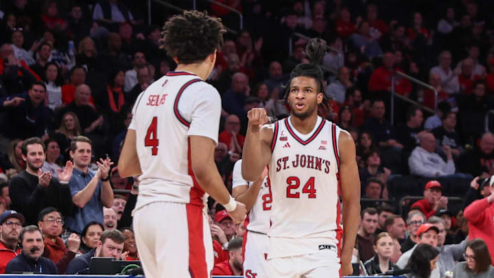 Jan 28, 2026; New York, New York, USA;  St. John's basketball forward Zuby Ejiofor (24) celebrates with guard Oziyah Sellers (4) in the second half against the Butler Bulldogs at Madison Square Garden.