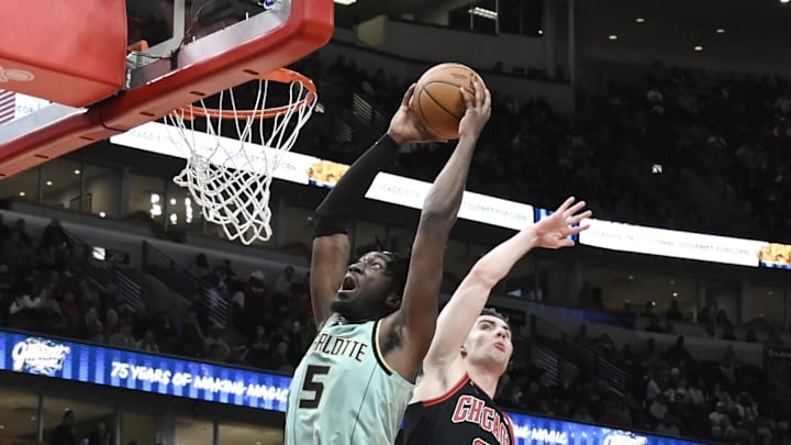 Dec 13, 2024; Chicago, Illinois, USA; Charlotte Hornets center Mark Williams (5) dunks the ball against Chicago Bulls guard Josh Giddey (3) during the second half at the United Center. Mandatory Credit: Matt Marton-Imagn Images