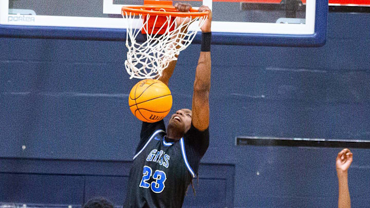 Gibbs High School center Mike Broxton jr (23) slam dunks the ball in the first half. Gibbs High School played St. Thomas Aquinas in the championship game of the Kingdom of the Sun at Vanguard High School in Ocala, FL on Monday, December 30, 2024. St. Thomas Aquinas defeated the Raiders 80-64. [Doug Engle/Ocala Star Banner]
