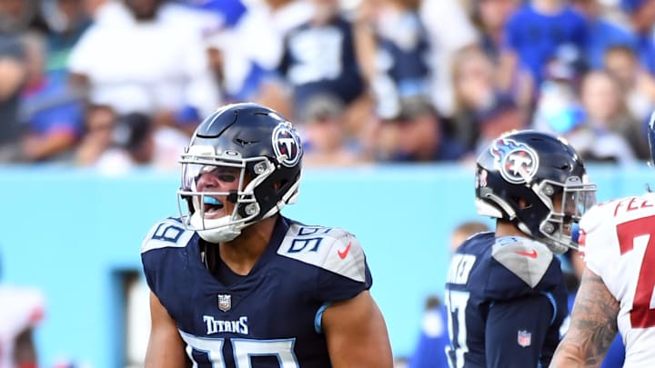 Sep 11, 2022; Nashville, Tennessee, USA; Tennessee Titans linebacker Rashad Weaver (99) celebrates after a sack during the second half against the New York Giants at Nissan Stadium. Mandatory Credit: Christopher Hanewinckel-USA TODAY Sports