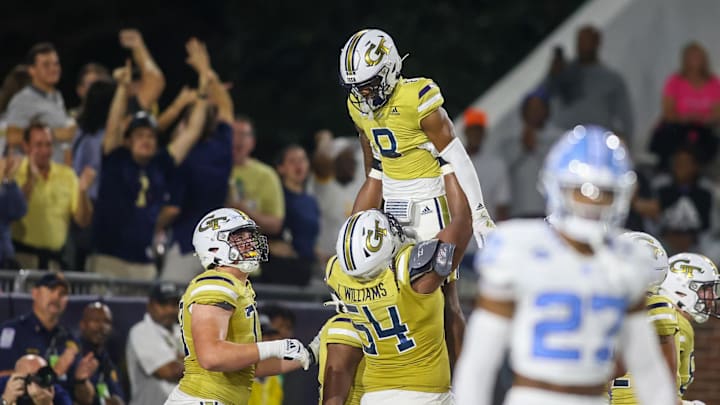 Oct 28, 2023; Atlanta, Georgia, USA; Georgia Tech Yellow Jackets wide receiver Malik Rutherford (8) celebrates with offensive lineman Tyler Gibson (74) after a touchdown against the North Carolina Tar Heels in the first half at Bobby Dodd Stadium at Hyundai Field. Mandatory Credit: Brett Davis-Imagn Images