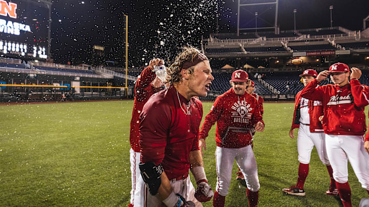 Nebraska right fielder Robby Bolin celebrates with teammates after his walk-off hit in the 10th inning over Michigan State at the Big Ten Tournament in Omaha.
