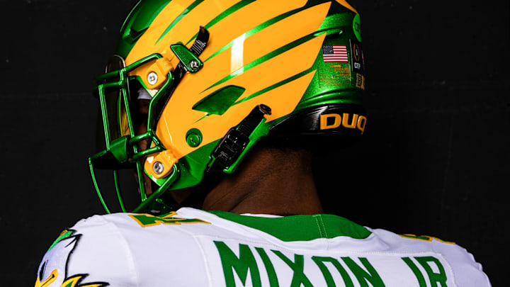 Linebacker Jerry Mixon Jr. wears the Oregon Ducks' uniforms for the Peach Bowl game against Indiana.