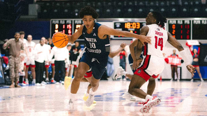 North Florida forward Josh Harris handles the ball in a North Florida home game from the 2025 season.