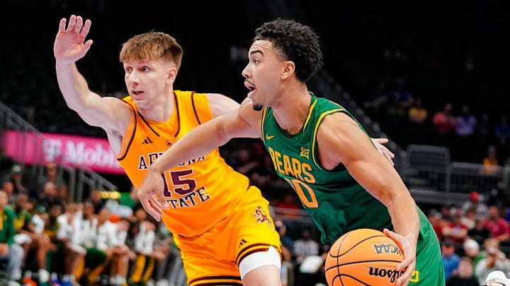Isaac Williams IV drives to the hoop against Arizona State Tuesday morning. 