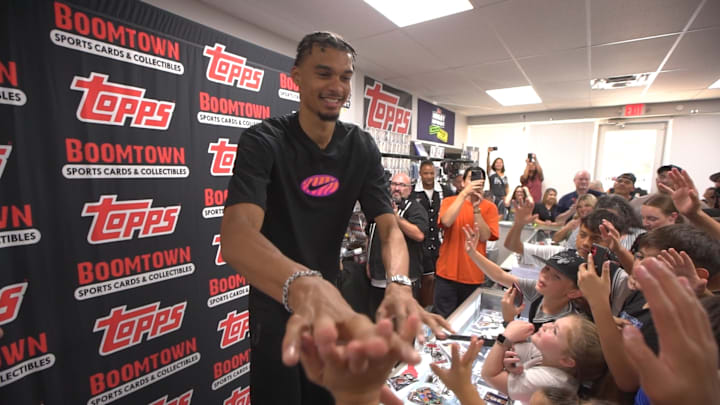 Sep 14, 2024; San Antonio, Texas, USA; San Antonio Spurs star Victor Wembanyama (1) interacts with fans at Topps Hobby Rip Night.