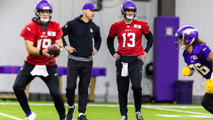 Daniel Jones (13) works with Vikings quarterback coach Josh McCown at team practice