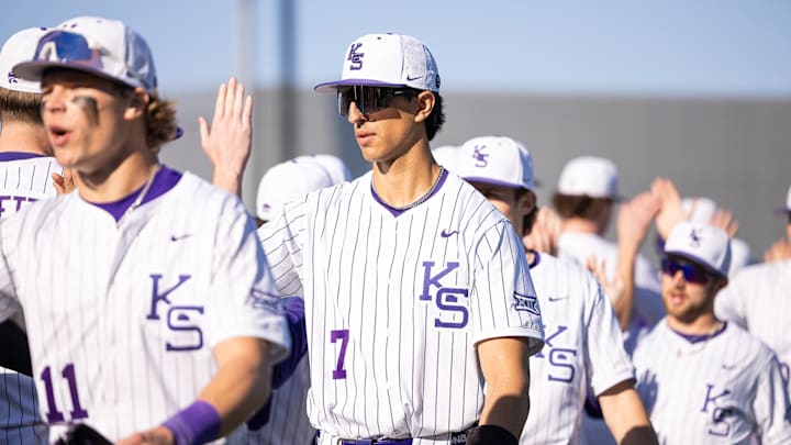 Kansas State Wildcats first baseman AJ Evasco congratulates teammates following midweek victory.