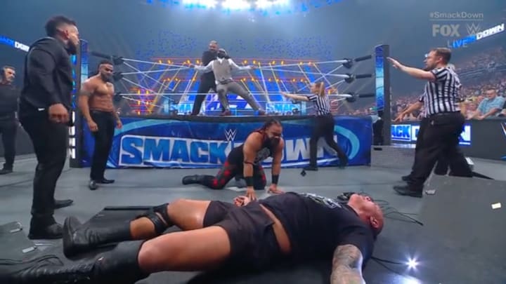 The Bloodline puts Randy Orton through a table while Cody Rhodes is forced to watch at the end of WWE Friday Night SmackDown. The Bloodline puts Randy Orton through a table while Cody Rhodes is forced to watch at the end of WWE Friday Night SmackDown.