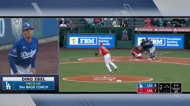 Dodgers third base coach Dino Ebel reacts as Teoscar Hernandez hits home run.