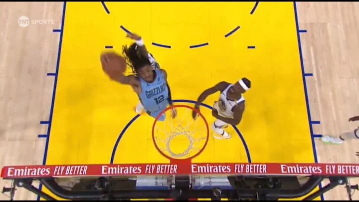 Ja Morant passes to himself off the backboard against the Golden State Warriors.