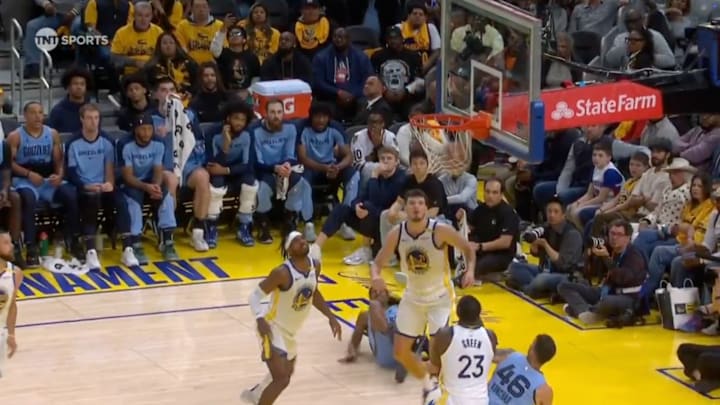 Ja Morant hits the ground after apparent ankle injury.