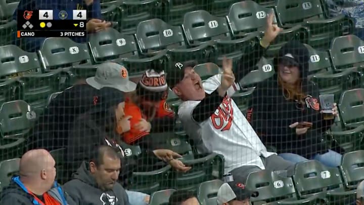An Orioles fan is delighted to learn he is on television.