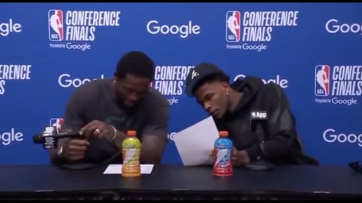 Anthony Edwards and Julius Randle look at the box score from Game 1 of the Western Conference finals.