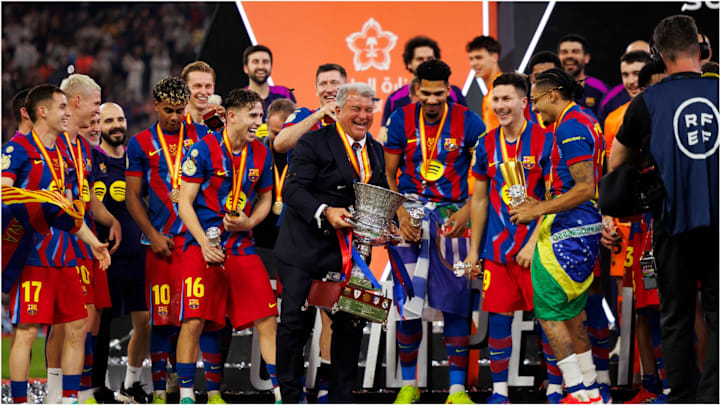 Barcelona have enjoyed great on-field success of late—to the delight of president Joan Laporta (center).