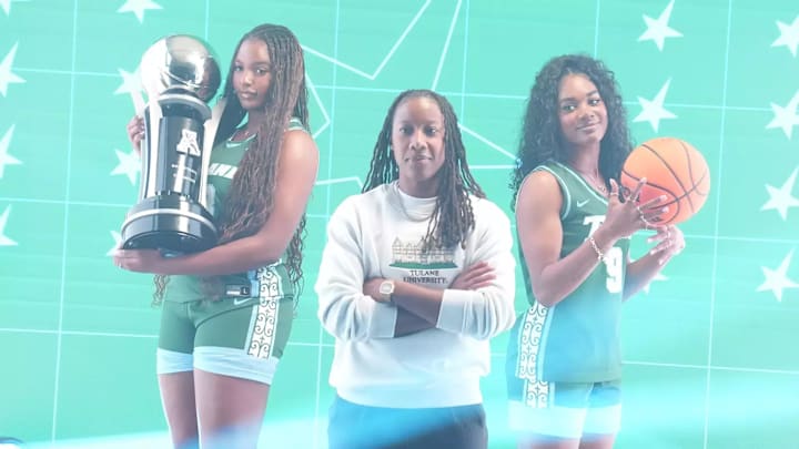 Tulane basketball coach Ashley Langford is flanked by Amira Mabry and Kendall Sneed