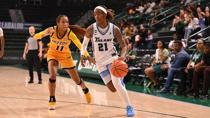Tulane guard Kanija Daniel drives against Missouri