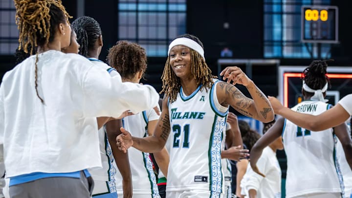 Tulane guard Kanija Daniel congratulates her teammates Tulane guard Kanija Daniel congratulates her teammates