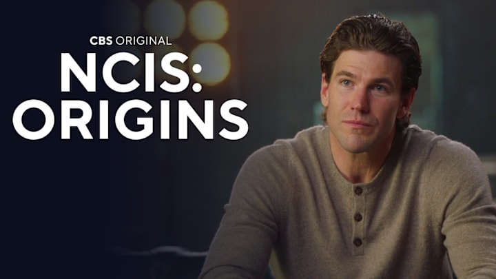 NCIS: ORIGINS follows a young Leroy Jethro Gibbs (Austin Stowell) in 1991, years prior to the events of NCIS, and is narrated by Mark Harmon. In the series, Gibbs starts his career as a newly minted special agent at the fledgling NCIS Camp Pendleton office where he forges his place on a gritty, ragtag team led by NCIS legend Mike Franks (Kyle Schmid). NCIS: ORIGINS stars Austin Stowell as young Leroy Jethro Gibbs, Kyle Schmid as Mike Franks, Mariel Molino as Special Agent Lala Dominguez, Tyla