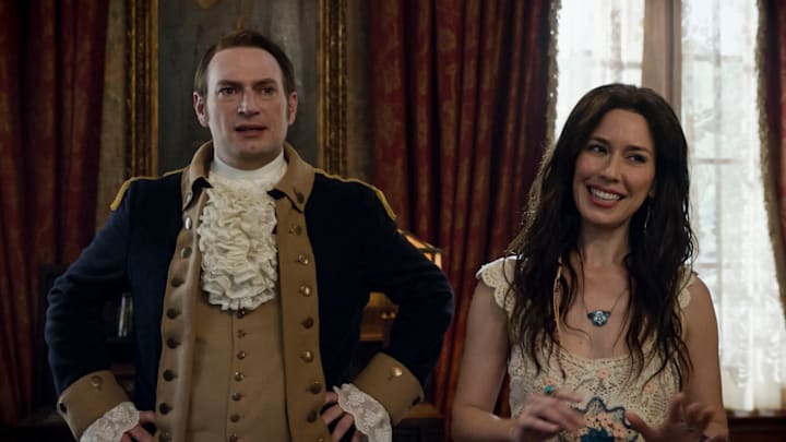 “Bring Your Daughter to Work Day” – GHOSTS. Pictured (L-R): Brandon Scott Jones as Isaac and Sheila Carrasco as Flower. Photo: CBS ©2025 CBS Broadcasting, Inc. All Rights Reserved. Highest quality screengrab available. “Bring Your Daughter to Work Day” – GHOSTS. Pictured (L-R): Brandon Scott Jones as Isaac and Sheila Carrasco as Flower. Photo: CBS ©2025 CBS Broadcasting, Inc. All Rights Reserved. Highest quality screengrab available.