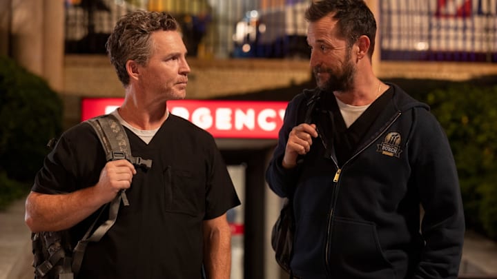 Noah Wyle and Shawn Hatosy in The Pitt on Max. Robby and Abbott exit the hospital and walk to the park. (Warrick Page/MAX)