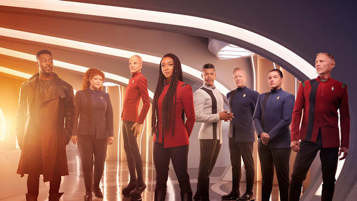 L-R David Ajala as Book, Mary Wiseman as Tilly, Doug Jones as Saru, Sonequa Martin-Green as Burnham, Wilson Cruz as Culber, Blu Del Barrio as Adira and Callum Keith Rennie as Raynor in season 5 of the Paramount+ original series STAR TREK: DISCOVERY. Photo Credit: James Dimmock/Paramount+