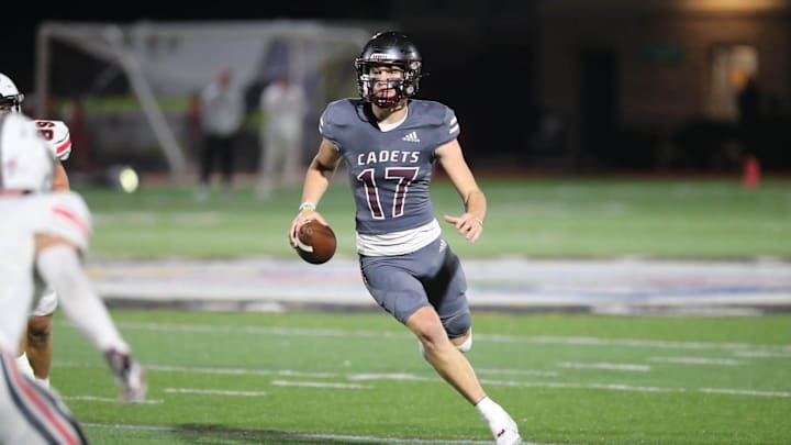 Benedictine quarterback Luke Kromenhoek finds some open field during Friday night's game against