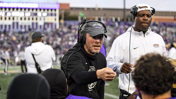 Lyle Hemphill coaches his defense on the sidelines at James Madison University. Lyle Hemphill coaches his defense on the sidelines at James Madison University.