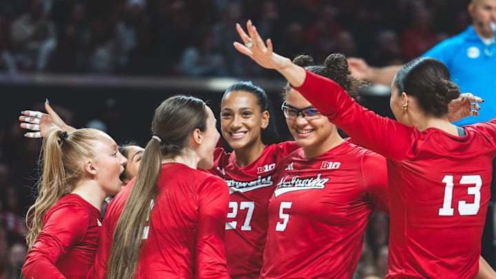 Nebraska volleyball players celebrate a point at Maryland.