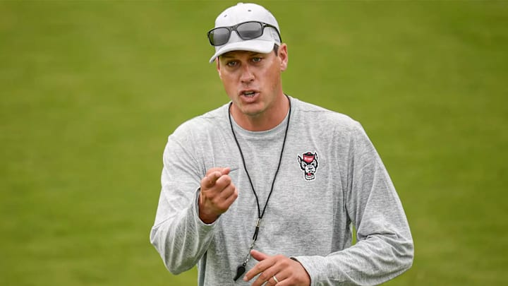 NC State defensive coordinator DJ Eliot coaches during a practice. 