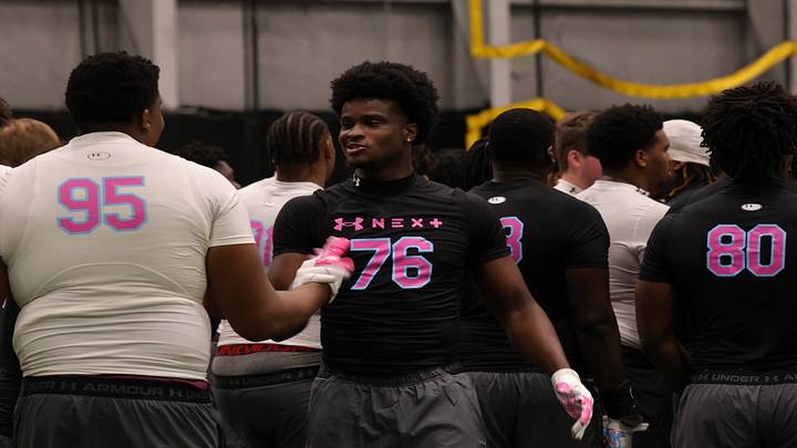 Success Nwabude daps up Houston County OL Braylin Mills 